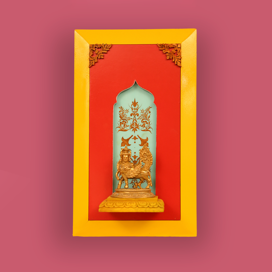 Brass Kamdhenu on a wooden stand with a beautiful painting in the background